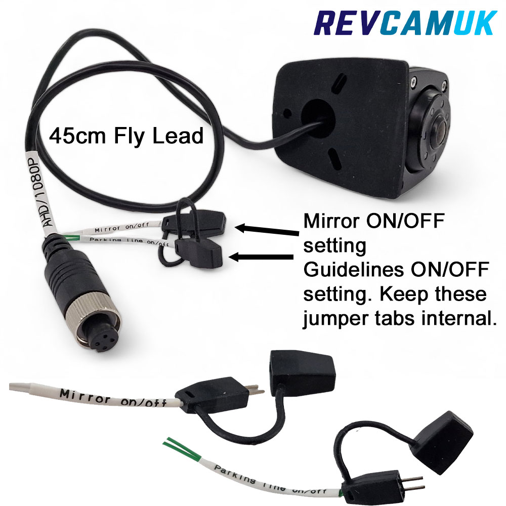 AHD 1080P reversing camera with 45cm fly lead, 4-pin aviation connector, and internal jumper tabs for mirror on/off and parking guidelines on/off settings, shown with close-up view of both jumper tab options