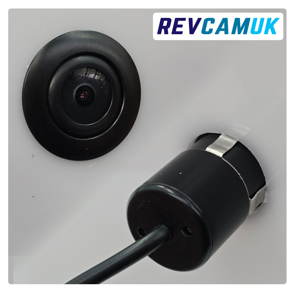 CAM086 mini bumper bullet reversing camera shown front and rear, designed to fit into an 18.5 mm mounting hole, supplied with matching hole saw, compact black flush-mount camera suitable for bumper or body panel installation.